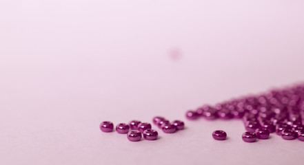 Heaps of violet glass beads