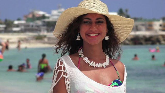 Woman Blowing Kisses And Waving At Beach