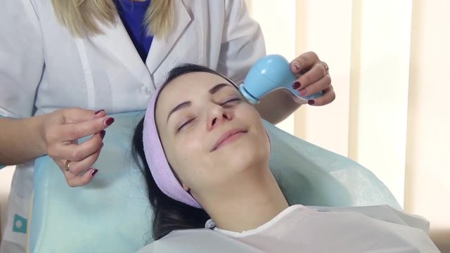 Young woman in a spa with facial mask. Woman in spa salon