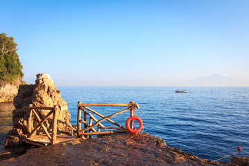 Scenic sea view with fishermans boat and Vesuvius, Italy. Gulf of Naples 