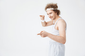 Side shot of funny man in old-fashioned fitness suit