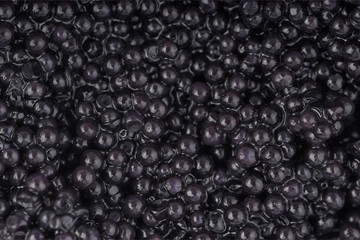 black caviar close up, texture black caviar