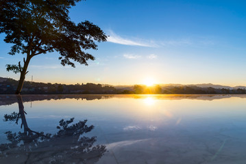 Beautiful of the swimming pool in sunset time.