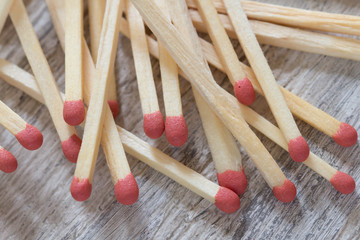 Heap of matches on wooden surface