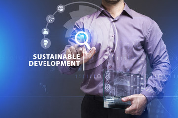 Business, Technology, Internet and network concept. Young businessman working on a virtual screen of the future and sees the inscription: Sustainable development