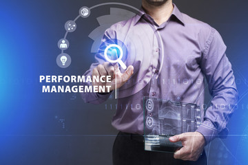 Business, Technology, Internet and network concept. Young businessman working on a virtual screen of the future and sees the inscription: Performance management