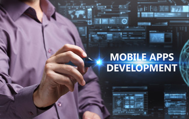 Business, Technology, Internet and network concept. Young businessman working on a virtual screen of the future and sees the inscription: Mobile apps development