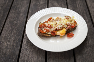 Tomato and egg on toast top with cheese, healthy breakfast