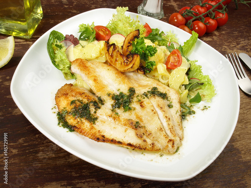 &amp;quot;Fischfilet in Butter gebraten mit Kartoffelsalat&amp;quot; Stock photo and ...