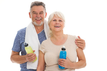 Fototapeta premium Fitness senior couple with towel and bottles 