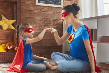 Girl and mom in Superhero costume