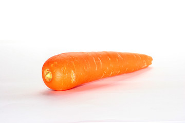 a single raw carrot over white background