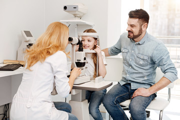 Attentive dad making sure his child being healthy