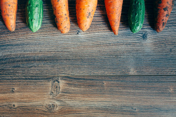 Dirty carrots on the table. Background. Vegetables of own production.