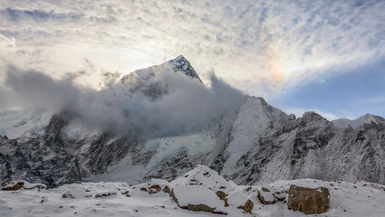 Nuptse wall view from Gorak Shep against sun halo - Nepal, Himalaya