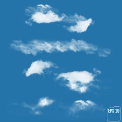 Set of Realistic clouds on a sky-blue background.  Vector illustration