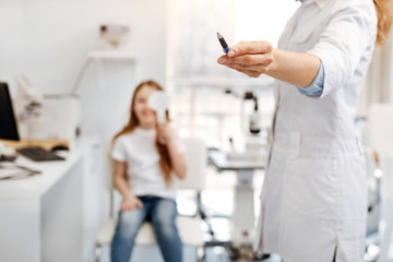 Active diligent girl doing an eye test