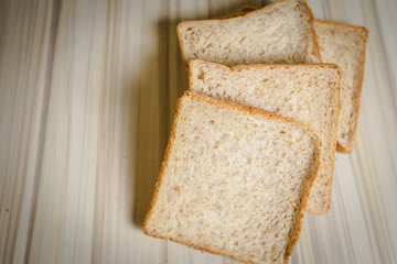 Whole wheat bread image on wood table in kitchen