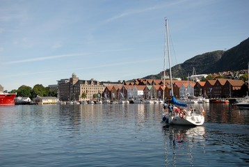 Fototapeta premium Yacht at Vagen bay, Bergen, Norway. Bryggen street in Bergen - architecture background