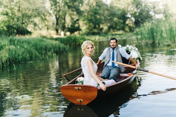 Foto op Canvas Young wedding couple posing on the boat © shunevich