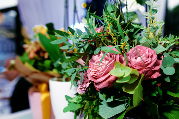 Bouquets of flowers at a wedding ceremony in a restaurant