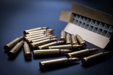 5.56  rounds and box on black background