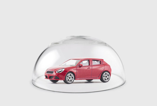 Red Car Protected Under A Glass Dome