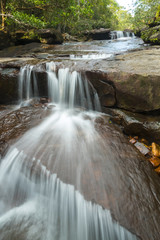 Fototapeta premium Beautiful waterfall in autumn forest, deep forest waterfall, Kanchanaburi province, Thailand