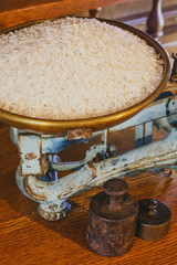Long grain rice on old weight