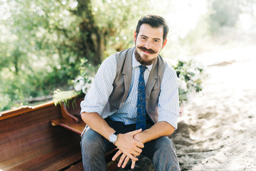 Handsome groom on the boat