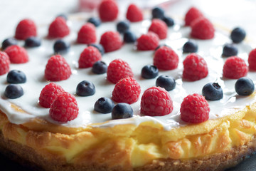 cheese cake with blueberries and raspberry