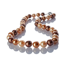 Luxury elegant golden pearl necklace close-up