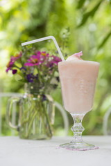 mix of the bright refreshing cocktails lime and strawberry daiquiri on a table in a restaurant with decoration of salt on the edge of the glass with fresh mint and lime slices and berries. soft focus