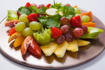 Mixed Fruit platter with assorted fruits on a white background