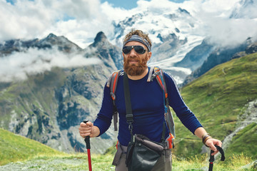 hiker on the trail in the Apls mountains. Trek near Matterhorn mount. Mountain ridge on the...