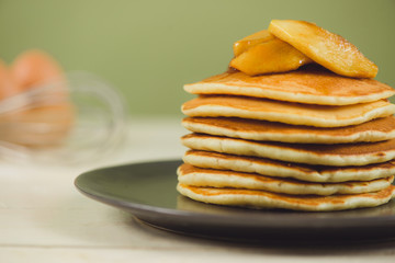 Pancakes with apple on table. Breakfast, snacks. Pancakes Day.