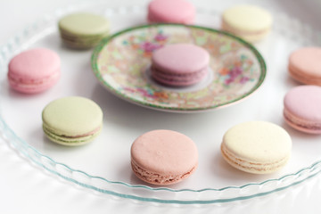 Closeup of colorful macaroons on the glass plate