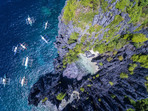 Aerial view of boats by rocky coast, Philippines
