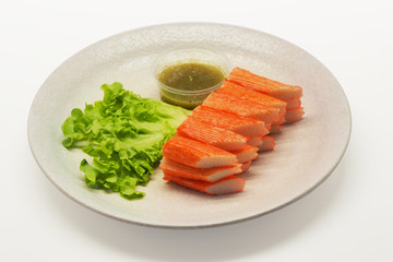 crab stick serve with spicy sauce on white background