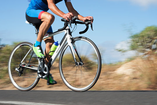 Motion blur of a bike race with the bicycle and rider at high speed