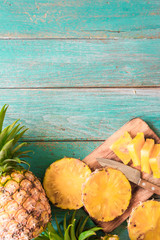 Fototapeta na wymiar pineapple on the wood texture background..