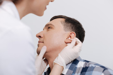 Close up of male head while being at checkup