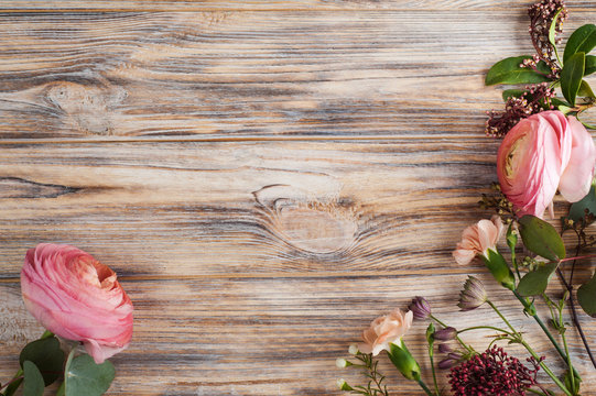 Flower decor on wooden background