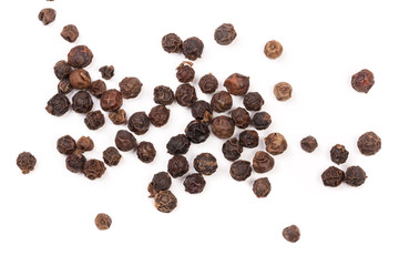 Black peppercorn isolated on white background. Top view