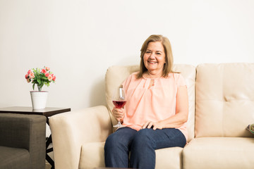 Mature woman drinking wine