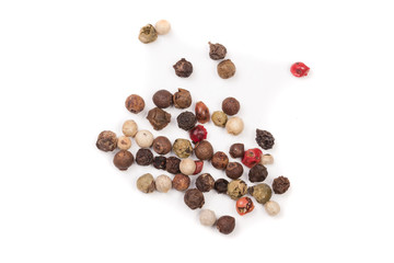 Mixture of peppers hot, red, black, white and green pepper isolated on white background. Top view