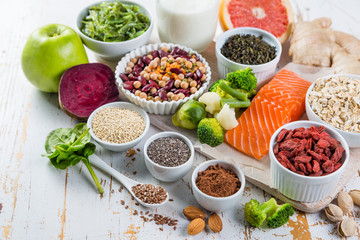 Selection of superfoods on rustic background