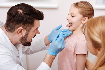 Fototapeta premium Very attentive doctor wrinkling his forehead