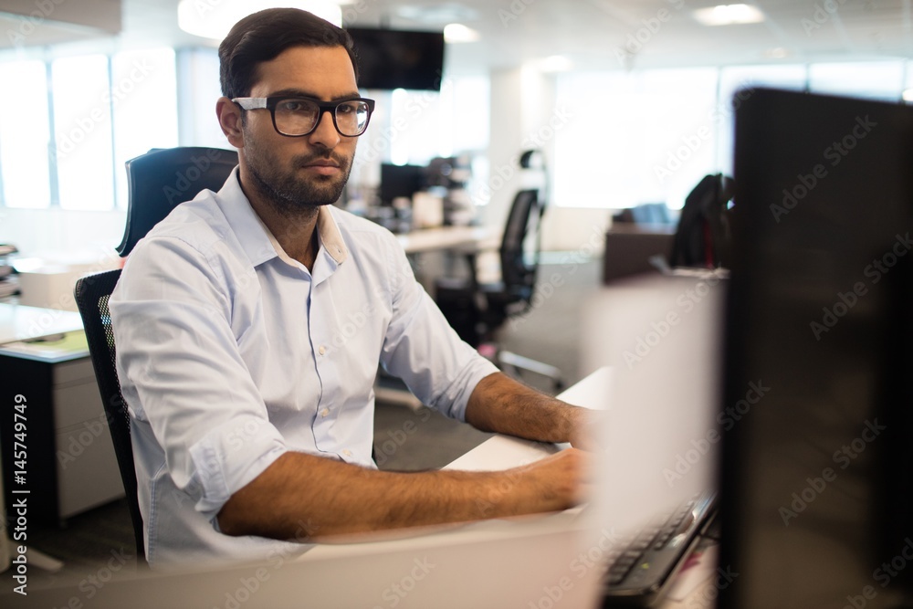 Wall mural concentrated businessman working in office