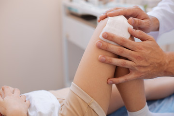 Close up of a medical dressing being put on the wound